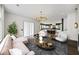 Open-concept living room with modern furnishings, accent lighting, and a view of the kitchen at 2220 Meadowvale Ne Dr, Atlanta, GA 30345