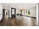 Open concept living room with fireplace, modern furnishings, and view to the hallway at 2220 Meadowvale Ne Dr, Atlanta, GA 30345