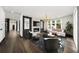 Spacious living room with fireplace, modern furnishings and view to the hallway at 2220 Meadowvale Ne Dr, Atlanta, GA 30345