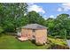 Aerial view of the back of this brick home with patio and landscaped yard at 3013 Huntshire, Doraville, GA 30340