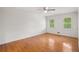 Spacious bedroom with hardwood floors, ceiling fan, and windows at 3013 Huntshire, Doraville, GA 30340