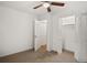This bedroom has a ceiling fan, carpeted floors, and a closet with folding doors at 3013 Huntshire, Doraville, GA 30340
