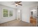 Cozy bedroom with a ceiling fan, a window with shutters, and a closet with louvered doors at 3013 Huntshire, Doraville, GA 30340