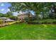 Sprawling front lawn and mature trees create a beautiful setting for this brick home at 3013 Huntshire, Doraville, GA 30340