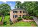 Well-maintained brick home with manicured lawn and mature trees at 3013 Huntshire, Doraville, GA 30340