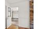 Hallway leading from the front door to the garage with white wainscoting at 3013 Huntshire, Doraville, GA 30340