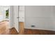 Hallway with hardwood floors and white wainscoting at 3013 Huntshire, Doraville, GA 30340