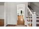 Hallway leading to a kitchen with white cabinets and stainless steel appliances at 3013 Huntshire, Doraville, GA 30340