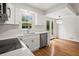 Kitchen featuring stainless steel appliances, quartz counters, subway tile backsplash, and hardwood floors at 3013 Huntshire, Doraville, GA 30340