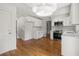 Eat-in kitchen featuring white cabinets, subway tile backsplash, and stainless steel appliances at 3013 Huntshire, Doraville, GA 30340