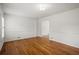 Bright living room featuring hardwood floors, white walls, and ample natural light at 3013 Huntshire, Doraville, GA 30340