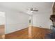 Spacious living room with hardwood floors, white walls, and a ceiling fan at 3013 Huntshire, Doraville, GA 30340