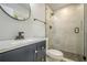 Modern bathroom featuring sleek fixtures, glass enclosed shower and a stylish vanity at 3160 Ann Se Rd, Smyrna, GA 30080
