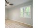 Bright bedroom with a large window, featuring laminate wood floors at 3160 Ann Se Rd, Smyrna, GA 30080