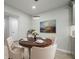 Bright dining area featuring a round wood table set for four with stylish modern chandelier at 3160 Ann Se Rd, Smyrna, GA 30080