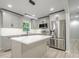 Modern kitchen featuring stainless steel appliances, gray cabinets and a center island at 3160 Ann Se Rd, Smyrna, GA 30080