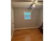 Clean bedroom featuring a window providing natural light and neutral walls at 4798 Mary Dale Ct, Lilburn, GA 30047