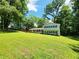 Charming home with a sprawling front yard and mature trees, offering a serene and private setting at 4798 Mary Dale Ct, Lilburn, GA 30047