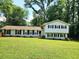 Well-maintained home featuring classic architecture and a lush green lawn, perfect for outdoor activities at 4798 Mary Dale Ct, Lilburn, GA 30047