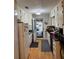 Functional kitchen featuring white cabinets, wood floors, and a bright open door, ready for culinary adventures at 4798 Mary Dale Ct, Lilburn, GA 30047
