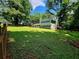 Spacious front yard with lush greenery, offering a picturesque view of the home and surrounding landscape at 4798 Mary Dale Ct, Lilburn, GA 30047