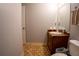 Bathroom featuring a dark wood vanity with plenty of open wall space at 4798 Marydale Sw Ct, Lilburn, GA 30047