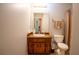 Bathroom featuring a large mirror and a vanity with good storage space at 4798 Marydale Sw Ct, Lilburn, GA 30047