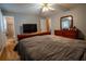 Bedroom featuring hardwood floors, neutral walls, and a full ensuite bathroom at 4798 Marydale Sw Ct, Lilburn, GA 30047