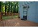 Exterior view of a wooden deck with a safety railing and a door to the home at 4798 Marydale Sw Ct, Lilburn, GA 30047