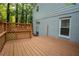 Wooden deck featuring a lattice privacy screen and a doorway leading to the home's interior at 4798 Marydale Sw Ct, Lilburn, GA 30047