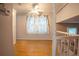Open view from the hallway upstairs reveals a light and airy interior with stylish curtains at 4798 Marydale Sw Ct, Lilburn, GA 30047
