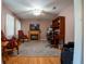 Cozy living room features a fireplace, hardwood floors, and comfortable seating at 4798 Marydale Sw Ct, Lilburn, GA 30047