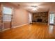 Bright living room featuring wood floors, a stone fireplace, and ample natural light at 4798 Marydale Sw Ct, Lilburn, GA 30047