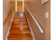 Classic staircase features wooden steps and dual handrails, connecting the home's levels at 4798 Marydale Sw Ct, Lilburn, GA 30047