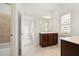 Bathroom with vanity, neutral tile floor and open doorway at 238 Avery Ne St, Marietta, GA 30060