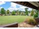 Expansive common green view showcasing neighborhood homes and lush landscaping from covered pavilion at 238 Avery Ne St, Marietta, GA 30060