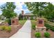 Well-maintained community entrance with manicured lawns and mature trees at 238 Avery Ne St, Marietta, GA 30060
