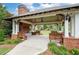 Spacious community pavilion with brick fireplace, ceiling fans, and comfortable seating overlooking the lush green common at 238 Avery Ne St, Marietta, GA 30060