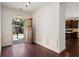 Inviting foyer with hardwood floors, wainscoting, and view into the kitchen at 238 Avery Ne St, Marietta, GA 30060