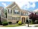 Charming two-story home boasts a stone and siding exterior with a welcoming front porch and landscaped yard at 238 Avery Ne St, Marietta, GA 30060