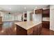 Open concept kitchen with a granite island, dark cabinets and view of the living room at 238 Avery Ne St, Marietta, GA 30060