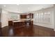 Kitchen with stainless appliances, dark cabinets, granite countertops and a center island at 238 Avery Ne St, Marietta, GA 30060