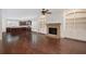 Spacious living room with fireplace, built-ins and open to a kitchen area at 238 Avery Ne St, Marietta, GA 30060