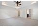 Spacious bedroom featuring neutral carpet, a modern ceiling fan, and doorway to the bathroom at 238 Avery Ne St, Marietta, GA 30060