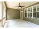 This screened porch offers tile flooring and an outdoor ceiling fan at 238 Avery Ne St, Marietta, GA 30060