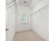 Walk-in closet with carpeted floors and wire shelving at 238 Avery Ne St, Marietta, GA 30060