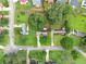 Aerial shot shows a home on a tree-lined street with well-maintained landscaping at 2711 Bethesda Ne Ct, Lawrenceville, GA 30044