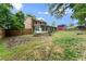 Brick home featuring a spacious yard with a wooden fence and a red barn at 2711 Bethesda Ne Ct, Lawrenceville, GA 30044
