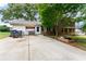 Exterior shot of a house with a spacious concrete backyard and a charming porch swing at 2711 Bethesda Ne Ct, Lawrenceville, GA 30044