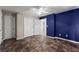 Bedroom featuring dark checkered floors and connecting doors and closet at 2711 Bethesda Ne Ct, Lawrenceville, GA 30044